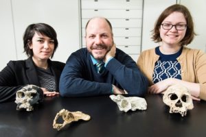  Alia Gurtov, Professor John Hawks, and postdoctoral fellow Caroline VanSickle are pictured with human fossils.